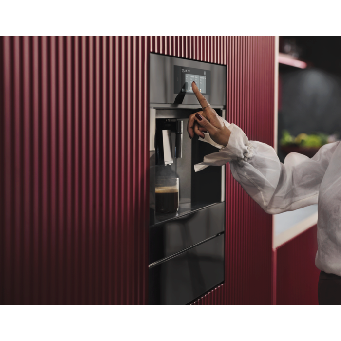 Built-in coffee machine designed to fit flush with kitchen cabinetry for a streamlined look.