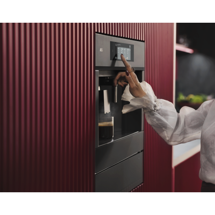 Built-in coffee machine designed to fit flush with kitchen cabinetry for a streamlined look.