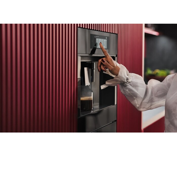 Built-in coffee machine designed to fit flush with kitchen cabinetry for a streamlined look.