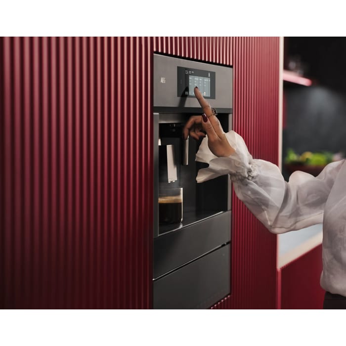 Built-in coffee machine designed to fit flush with kitchen cabinetry for a streamlined look.