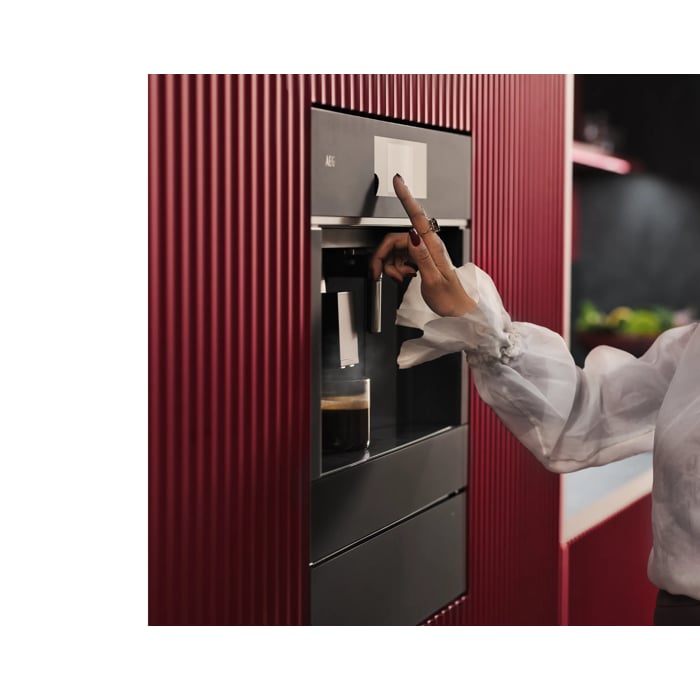 Built-in coffee machine designed to fit flush with kitchen cabinetry for a streamlined look.